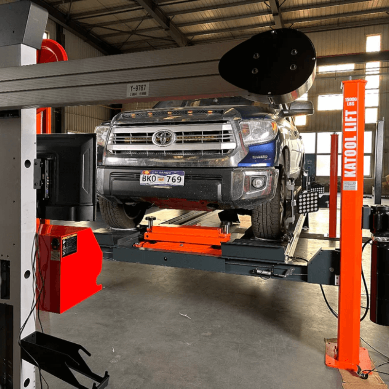 Katool AV533 3D wheel alignment machine in workshop with pickup truck positioned on lift for alignment service