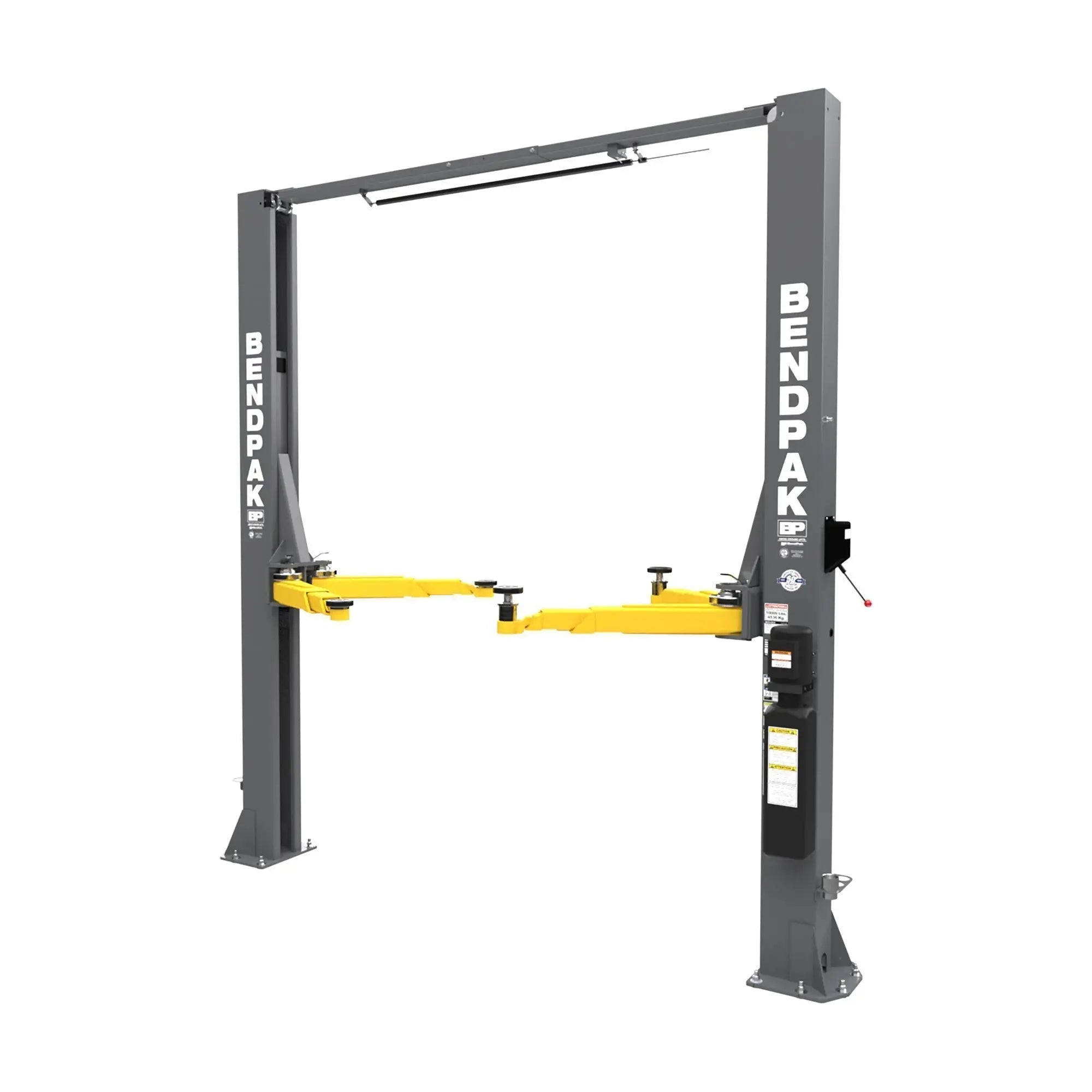 BendPak 10APX two-post lift front view showing clearfloor frame, overhead beam, and asymmetric yellow lift arms positioned for vehicle support.