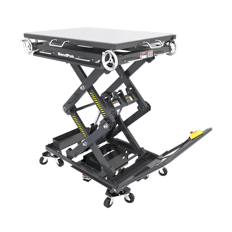 BendPak EVS3000 battery pack lift table shown in raised position with roller-top surface, scissor lift mechanism, and control handle for precise electric vehicle battery service.