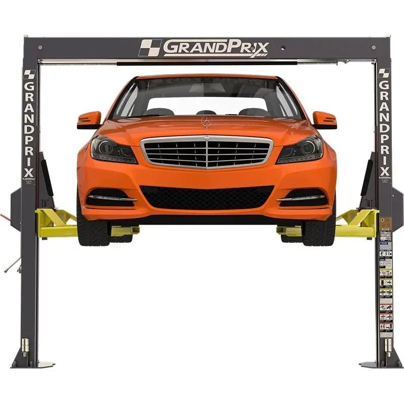 BendPak GP-7LCS two-post car lift shown lifting an orange sedan between GrandPrix low-ceiling columns with asymmetric arms and compact garage configuration.