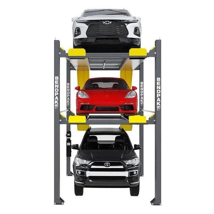 Front view of BendPak HD-973PX triple-stacking four-post parking lift showing three vehicles — a white sedan on the top, a red sports car in the middle, and a black SUV on the bottom — supported by gray steel columns and yellow ramps on a white background.