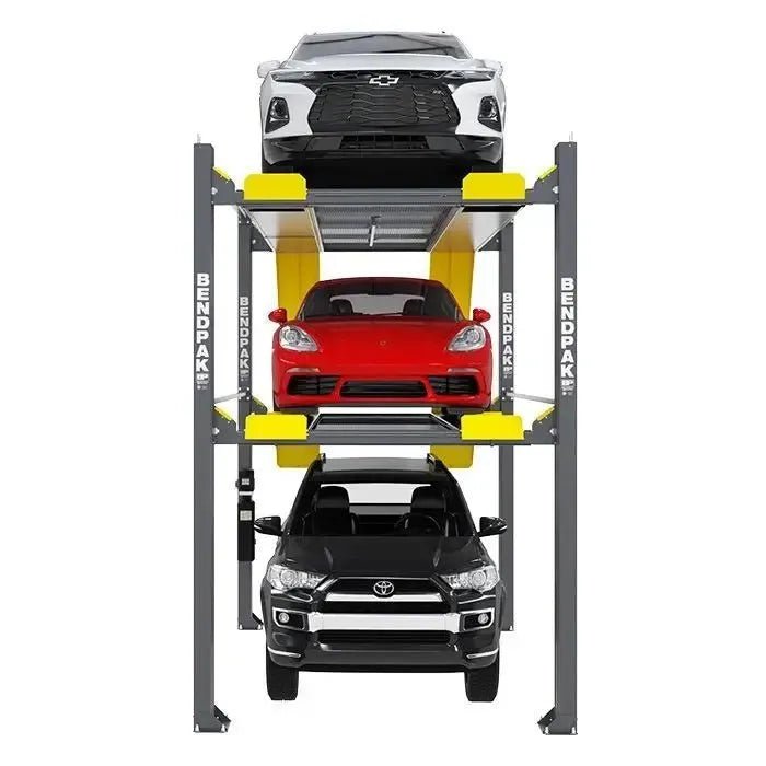 Front view of BendPak HD-973PX triple-stacking four-post parking lift showing three vehicles — a white sedan on the top, a red sports car in the middle, and a black SUV on the bottom — supported by gray steel columns and yellow ramps on a white background.