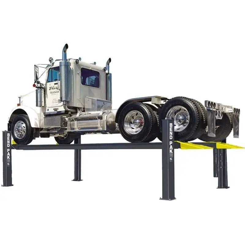 BendPak HDS-40 heavy-duty four-post lift raising a large semi-truck tractor, showcasing its 40,000-lb capacity and industrial-grade steel construction.