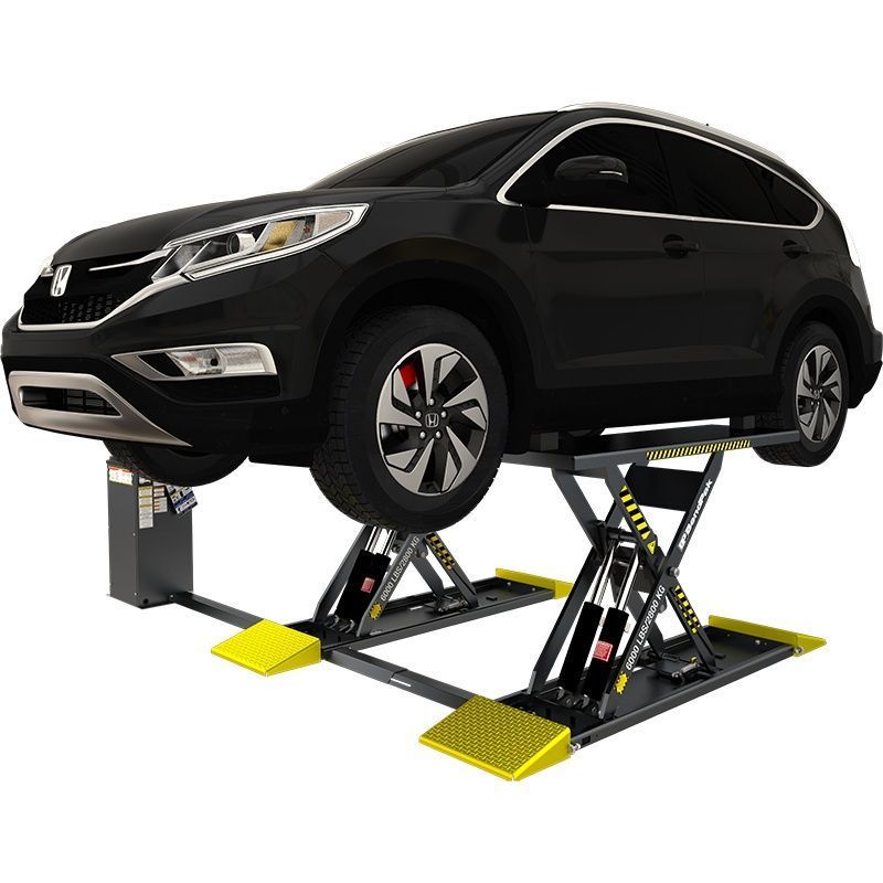 BendPak MDS-6LP mid-rise scissor lift raising a black SUV; hero angle shows low-profile platforms, yellow approach ramps, and a remote power unit beside the lift.