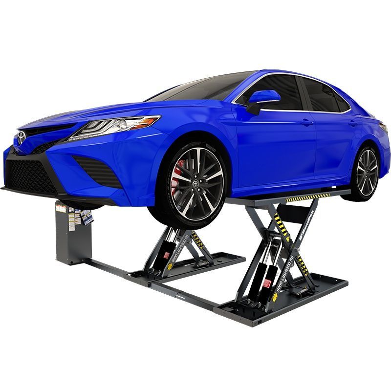 BendPak MDS-6LPF mid-rise scissor lift raising a blue sedan; front angled view shows dual platforms, yellow ramps, and hydraulic power unit.