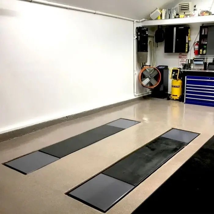 BendPak SP-7XEF full-rise scissor lift 7,000 lb capacity; close-up showing wide lifting platforms with safety strip and reinforced cross braces