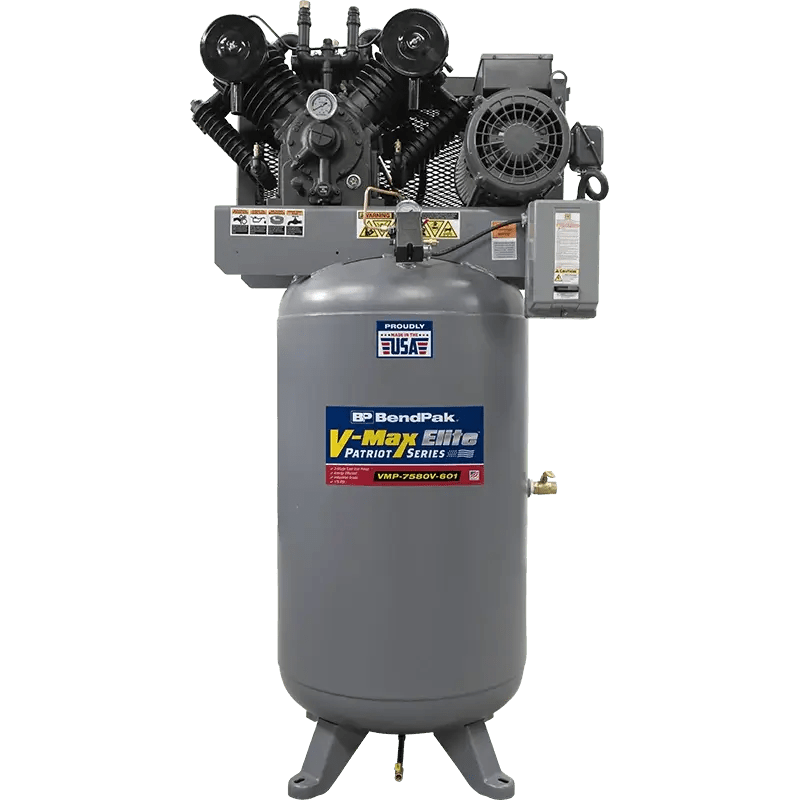Front view of BendPak VMP-7580V-601 V-Max Patriot air compressor with 7.5 HP motor and 80-gallon vertical tank, showing dual-cylinder cast iron pump, belt drive system, and gray steel body on transparent background.