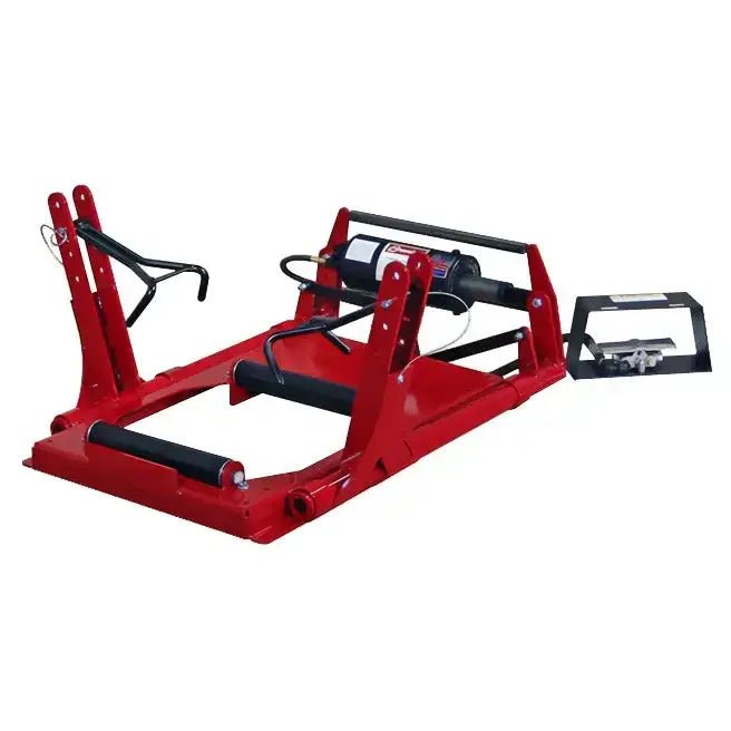 Branick 5200 truck tire spreader, air-powered roll-on model with red steel frame, adjustable arms, roller platform, and foot controls for heavy-duty truck tire inspection and repair.