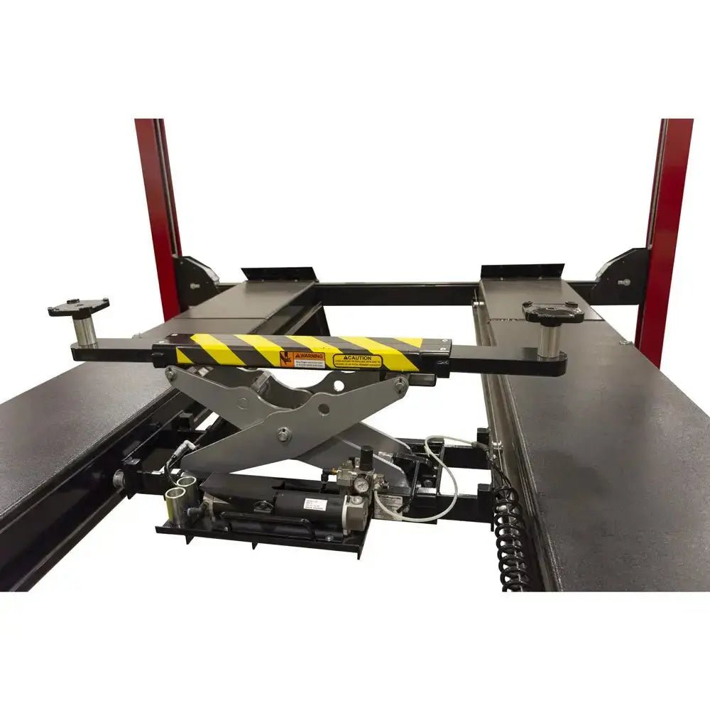 Challenger RJ7.5 rolling jack mounted between four post lift runways, featuring hydraulic scissor design with yellow safety markings for 7500 lb lifting capacity
