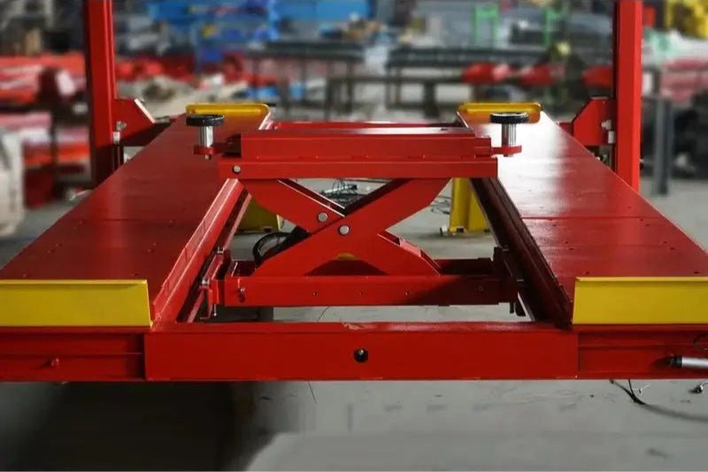 Katool KT-4H150 4 Post Alignment Lift view with rolling jack between runways; scissor linkage and rubber pads for wheel-free lifting.