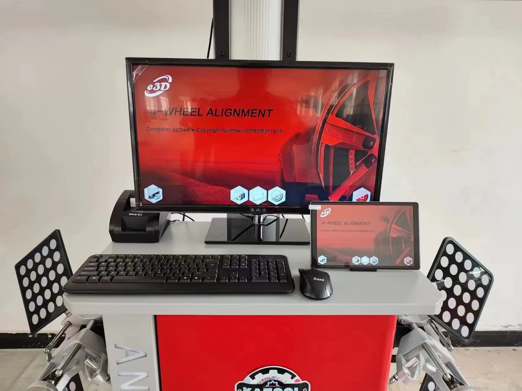 Katool KT-AV6 3D Wheel Alignment Machine control setup showing dual monitors, keyboard, and mouse running the 3D alignment software interface on a red equipment cabinet.