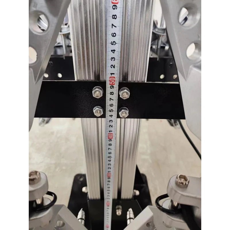 Katool KT-AV9 wheel alignment machine close-up of lifting column with height measurement scale, cross-brace bracket, bolts, and guide rails.