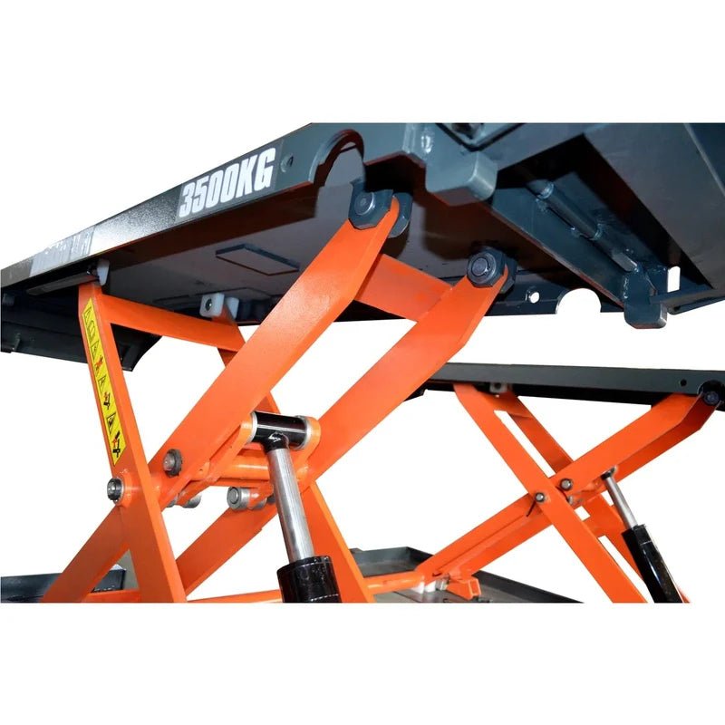 Katool KT-X80 pneumatic mid-rise scissor lift underside showing scissor linkage and hydraulic cylinder, rated 8000 lb capacity.