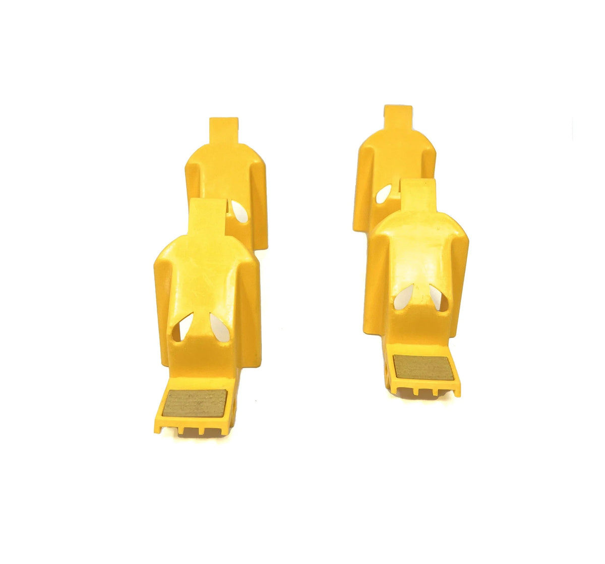 Four yellow plastic outside jaw covers viewed from the front.