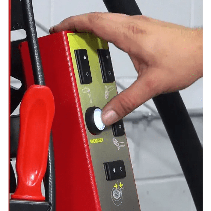 Person’s hand operating Rotary R1250 Leverless Tire Changer control panel with glowing button