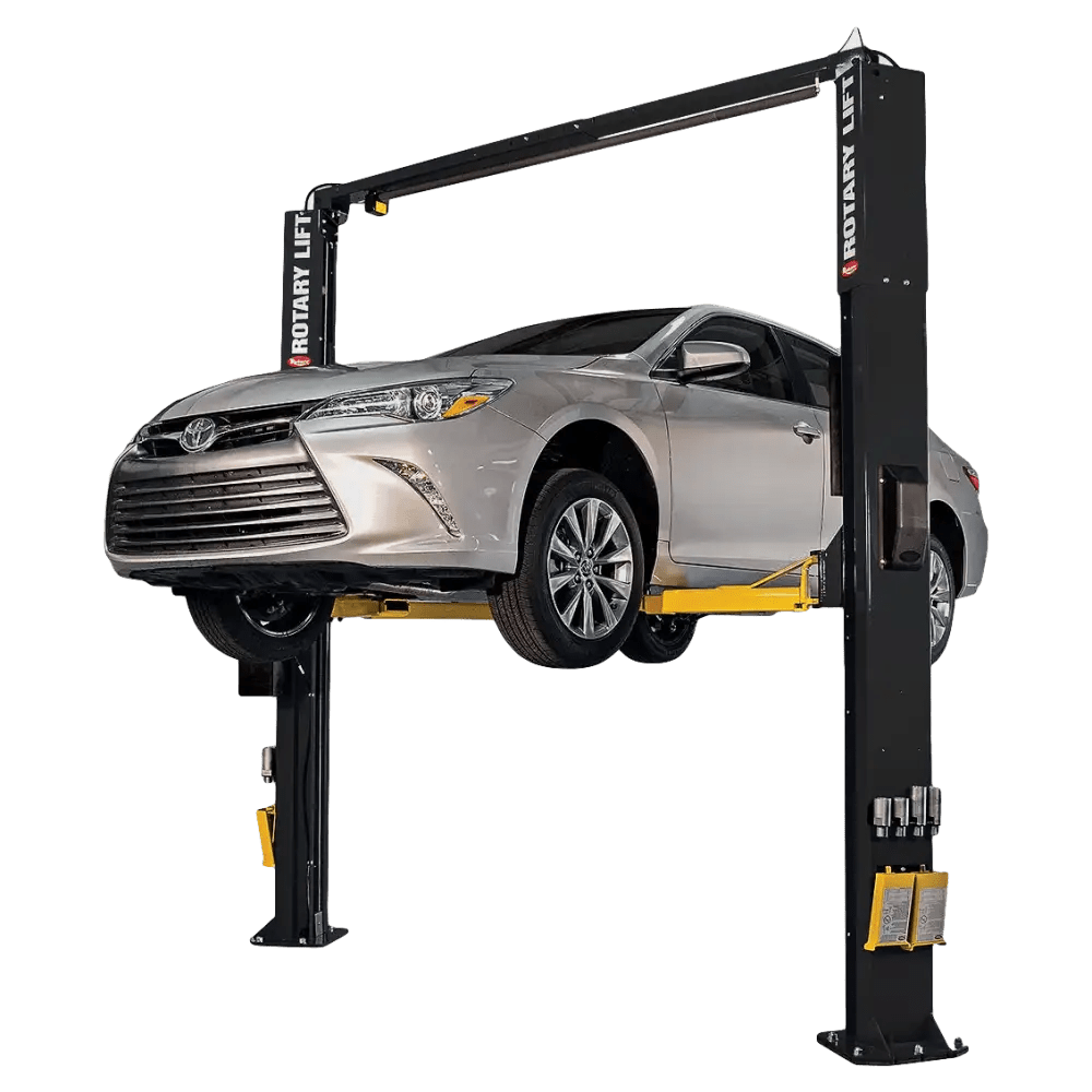 Two-post asymmetrical lift holding a silver Toyota Camry on Rotary SPOA10 10K