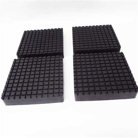 TRIUMPH 12345 set of four black square lift pads arranged side by side