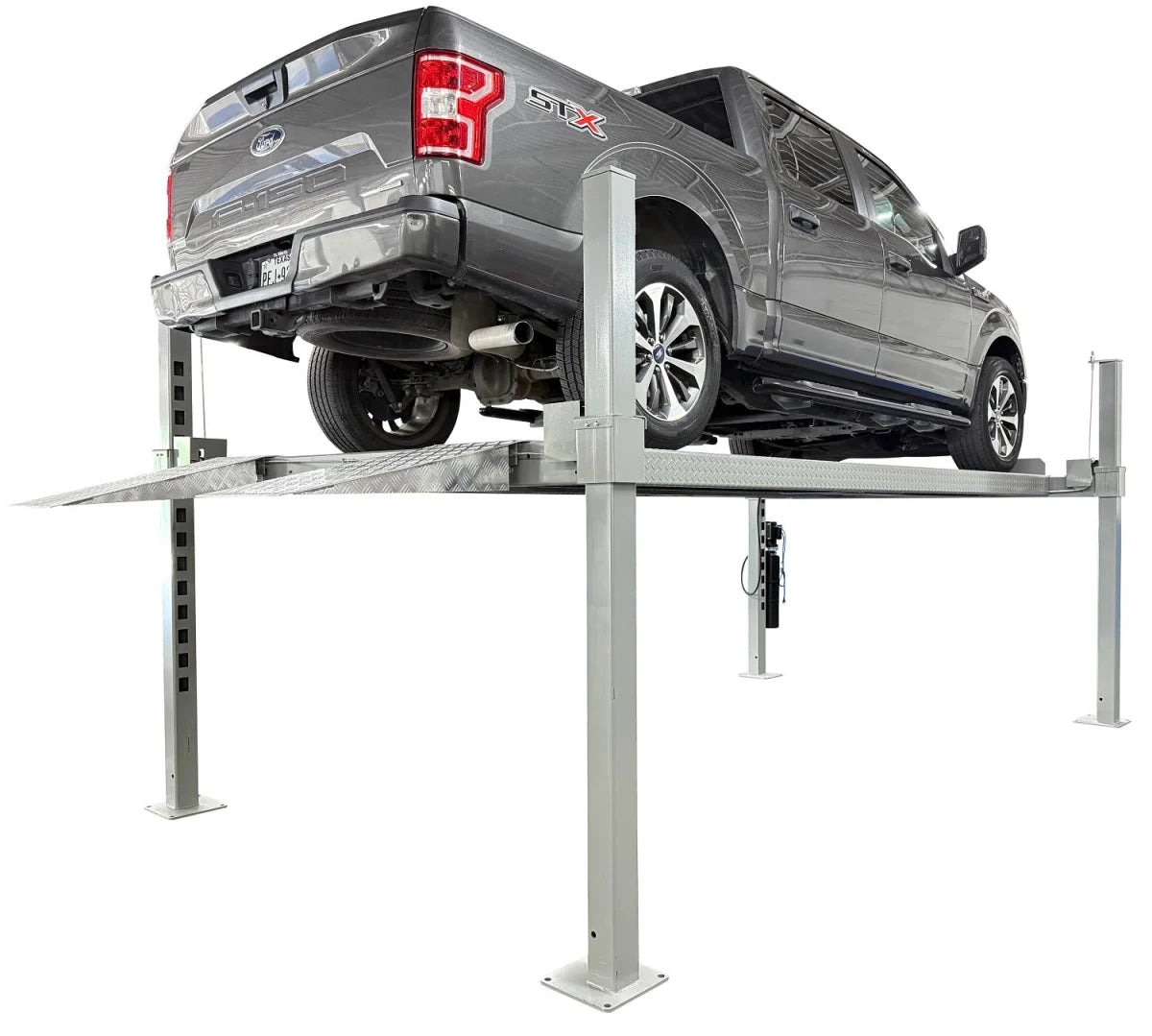 SUV raised on Triumph NOS10000 10,000 lb 4 post car lift, rear three-quarter view