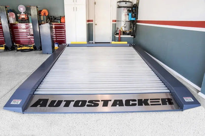 Autostacker A6W-OPT1 extra wide parking lift in a home garage with the galvanized platform lowered flush to the floor
