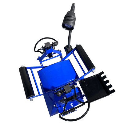 TRIUMPH TS-850 tire spreader shown from top angle with controls and black pedal assembly.