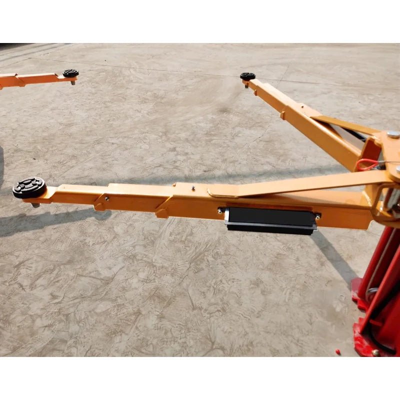 Triple-telescoping arms fully extended for wide vehicle support