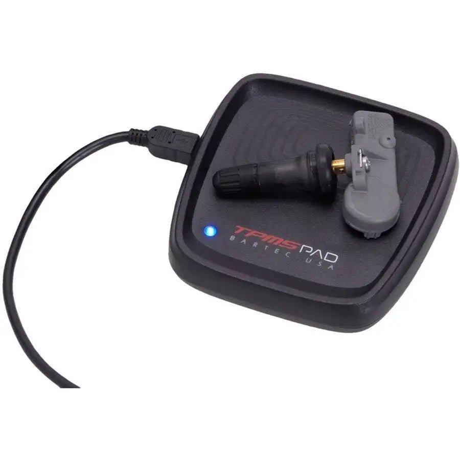 Compact Bartec TPMS-PAD programming accessory device featuring 4x4 inch form factor with USB connectivity for PC-based EZ-sensor programming, designed for professional automotive workshops requiring dedicated TPMS sensor programming workstations without tying up handheld diagnostic tools