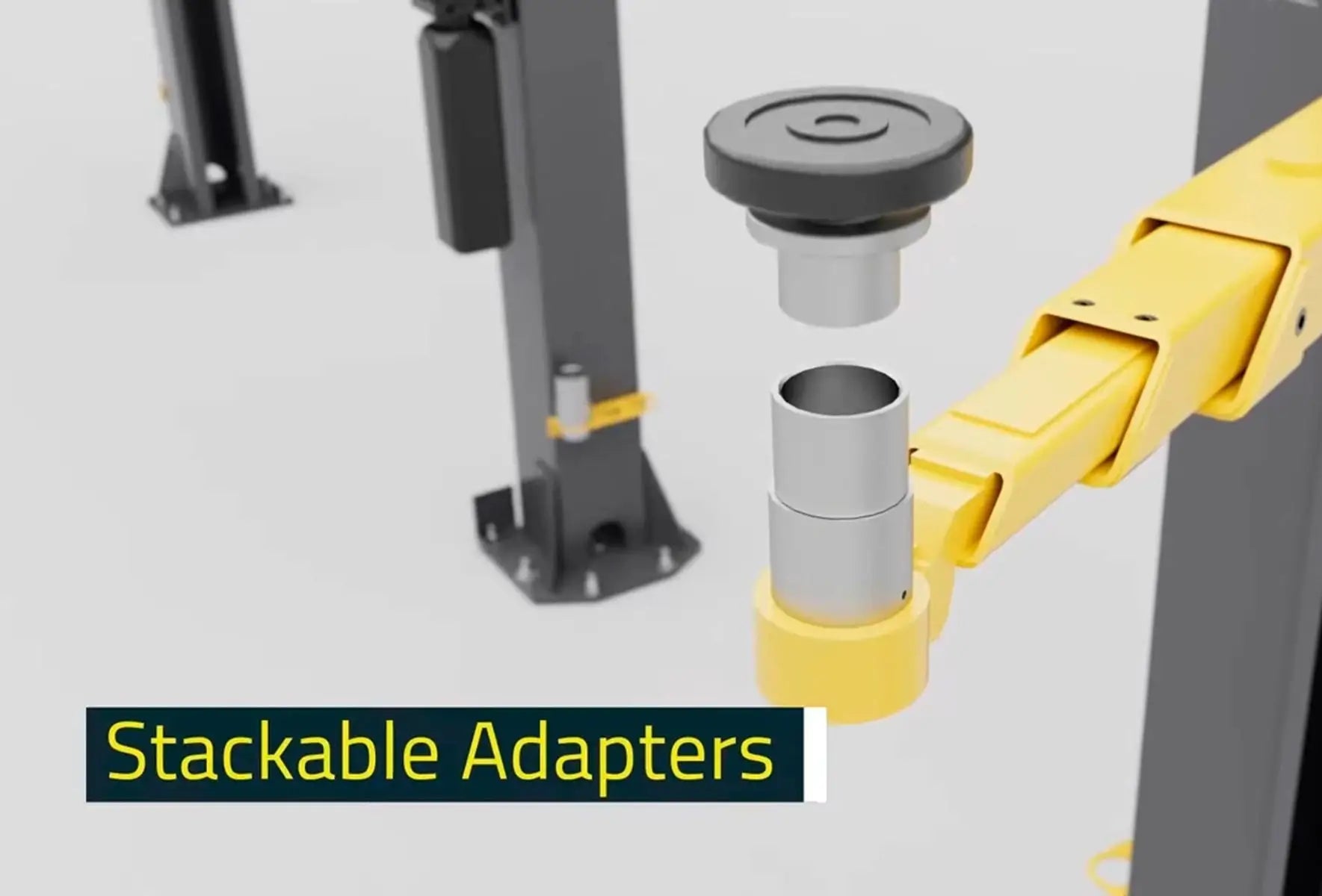 BendPak 10AP two-post lift closeup showing stackable height adapters and yellow lift arm receiver illustrating modular setup on neutral gray surface.