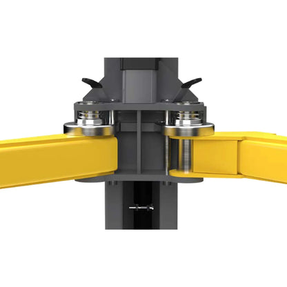 BendPak 10APX two-post lift closeup showing automatic arm restraint system with dual pivot joints, steel gears, and locking pins securing yellow lift arms.