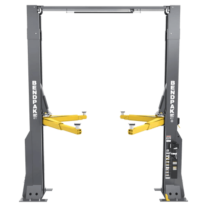 BendPak 16AP-192 two-post lift, front view highlighting extended-height clearfloor design with gray steel columns, yellow lifting arms, overhead beam, and control panel decal.