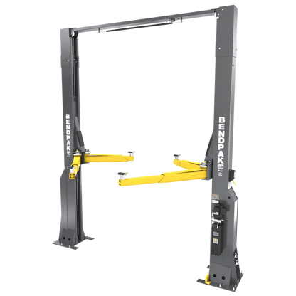 BendPak 16AP-192 two-post lift, angled right-side view showing extended-height structure, yellow arms, overhead bar, and gray columns with BendPak branding.