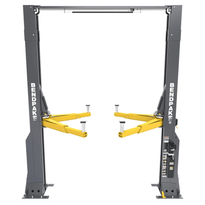 BendPak 20AP-192 two-post lift, front view showing heavy-duty extended-height design with yellow telescoping lift arms, overhead beam, and BendPak-branded gray columns.