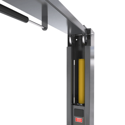 BendPak 20AP two-post lift closeup of hydraulic cylinder assembly inside column, showing yellow piston housing, steel guide rails, and overhead crossbeam connection.