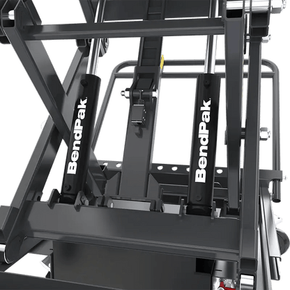 BendPak EVS3000 battery pack lift table closeup showing dual BendPak-branded hydraulic cylinders providing stable lifting force and synchronized vertical motion for EV service.