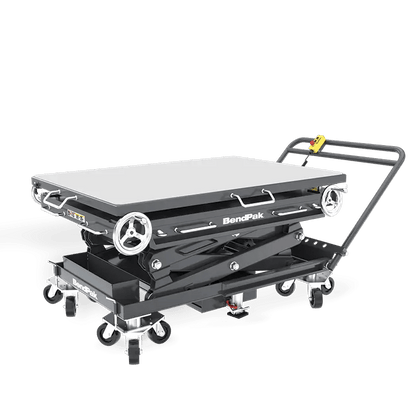 BendPak EVS3000 battery pack lift table in low-profile position, showing roller-top platform, scissor lift structure, and control handle with mounted pendant control.