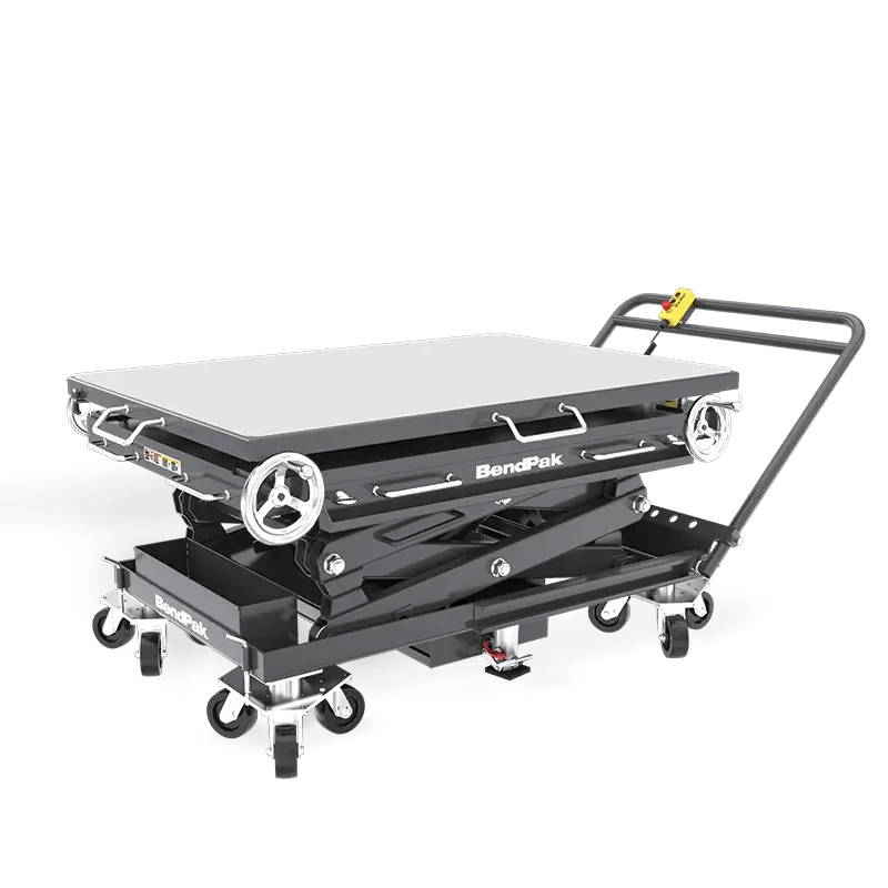BendPak EVS3000 battery pack lift table in low-profile position, showing roller-top platform, scissor lift structure, and control handle with mounted pendant control.