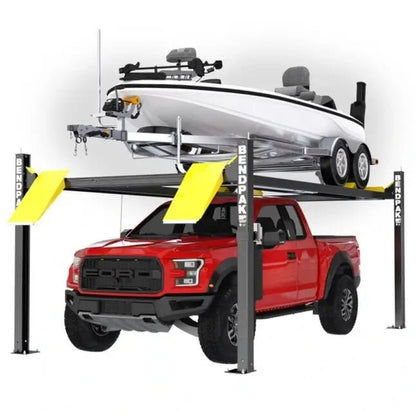 BendPak HD-7500BLX extended-length four-post lift holding a red pickup truck on the bottom platform and a white boat with trailer above, featuring yellow ramps, tall steel columns, and reinforced runways for long vehicle and boat storage.