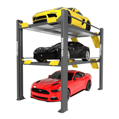 Angled front-right view of BendPak HD-973P triple-stacking four-post parking lift with yellow, black, and red sports cars on each level, showing gray steel columns and yellow safety ramps on a transparent background.