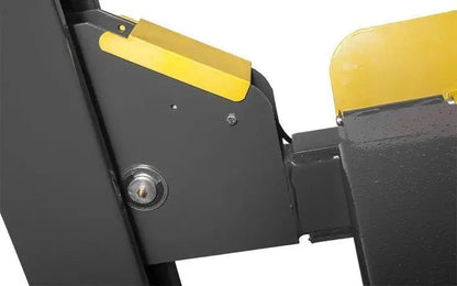 BendPak HD-9ST four-post lift closeup of cross member carriage showing column connection, yellow end cap, and locking pin interface for lift alignment.