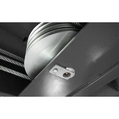 BendPak HDS-18E four post lift cable sheaves closeup under the runway showing grooved pulleys and wire ropes for the equalization system