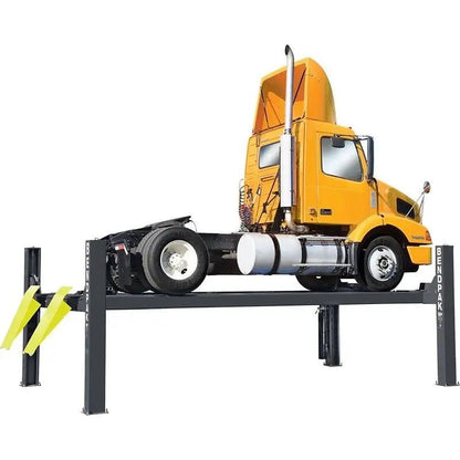 BendPak HDS-27 four-post lift shown lifting a yellow semi-truck tractor, featuring heavy-duty steel construction, long runways, and 27,000-lb capacity for commercial vehicles.