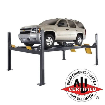 BendPak HDS-14LSXE extended four-post alignment lift in a professional garage setup, showing long wheelbase platform and dual approach ramps.