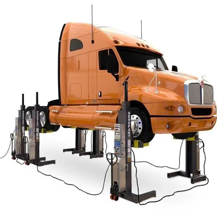 BendPak PCL-18B-6 mobile column lift system raising an orange semi-truck; six wireless hydraulic columns positioned at each wheel for full heavy-duty vehicle support.