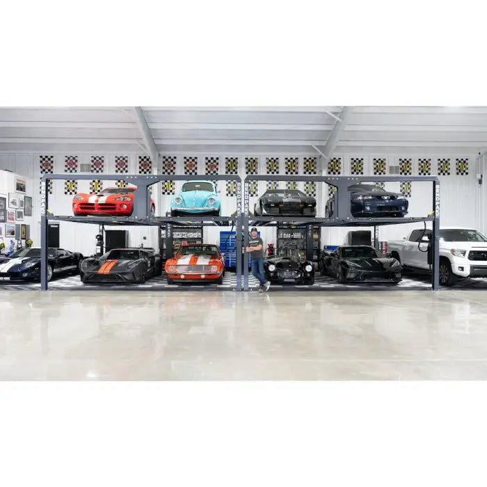 BendPak PL-12000DP four-post tandem parking lift wide shot; complete row of lifts holding sports cars and trucks in an organized automotive collection.