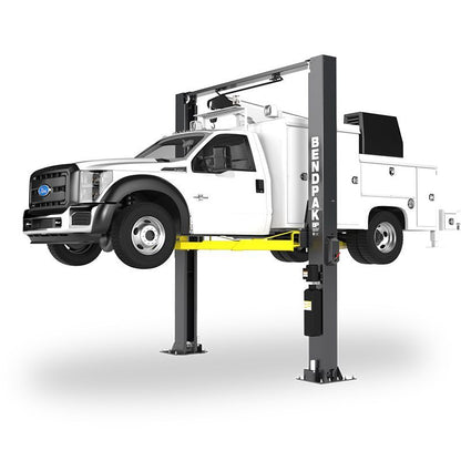 BendPak XPR-12CL-192-LTA two-post lift raising a white Ford service truck; hero view highlighting extended-height columns and long-reach telescoping arms