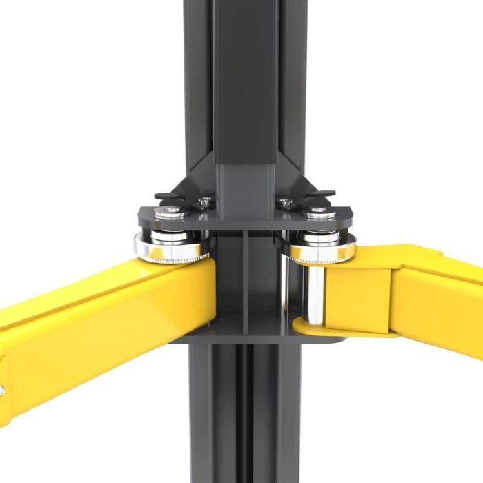 BendPak XPR-12CL two-post lift arm restraint mechanism close-up showing dual pivot pins, reinforced joints, and grease fittings for stability and safety.