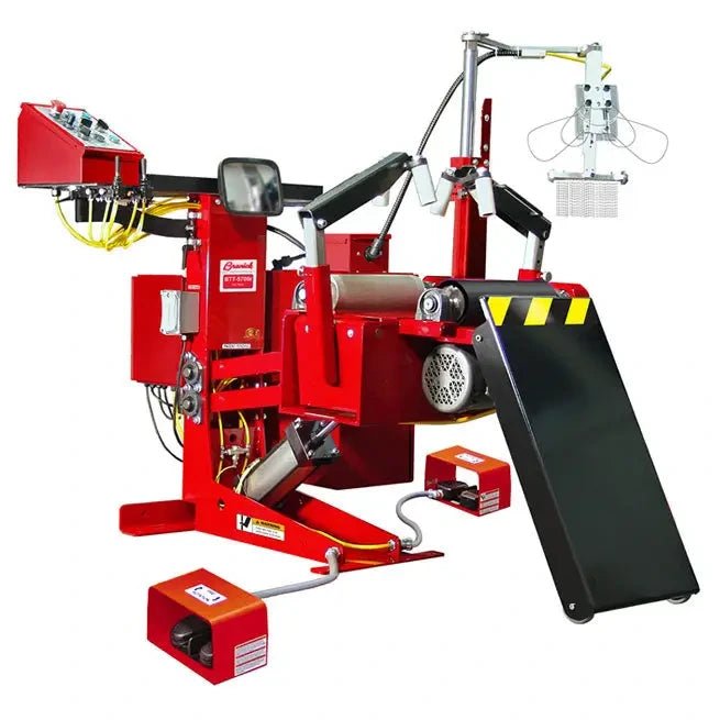 Branick 5700E tire spreader, side angled view showing adjustable-height hydraulic frame, pneumatic controls, overhead inspection light, and black tilting platform for precision tire service.