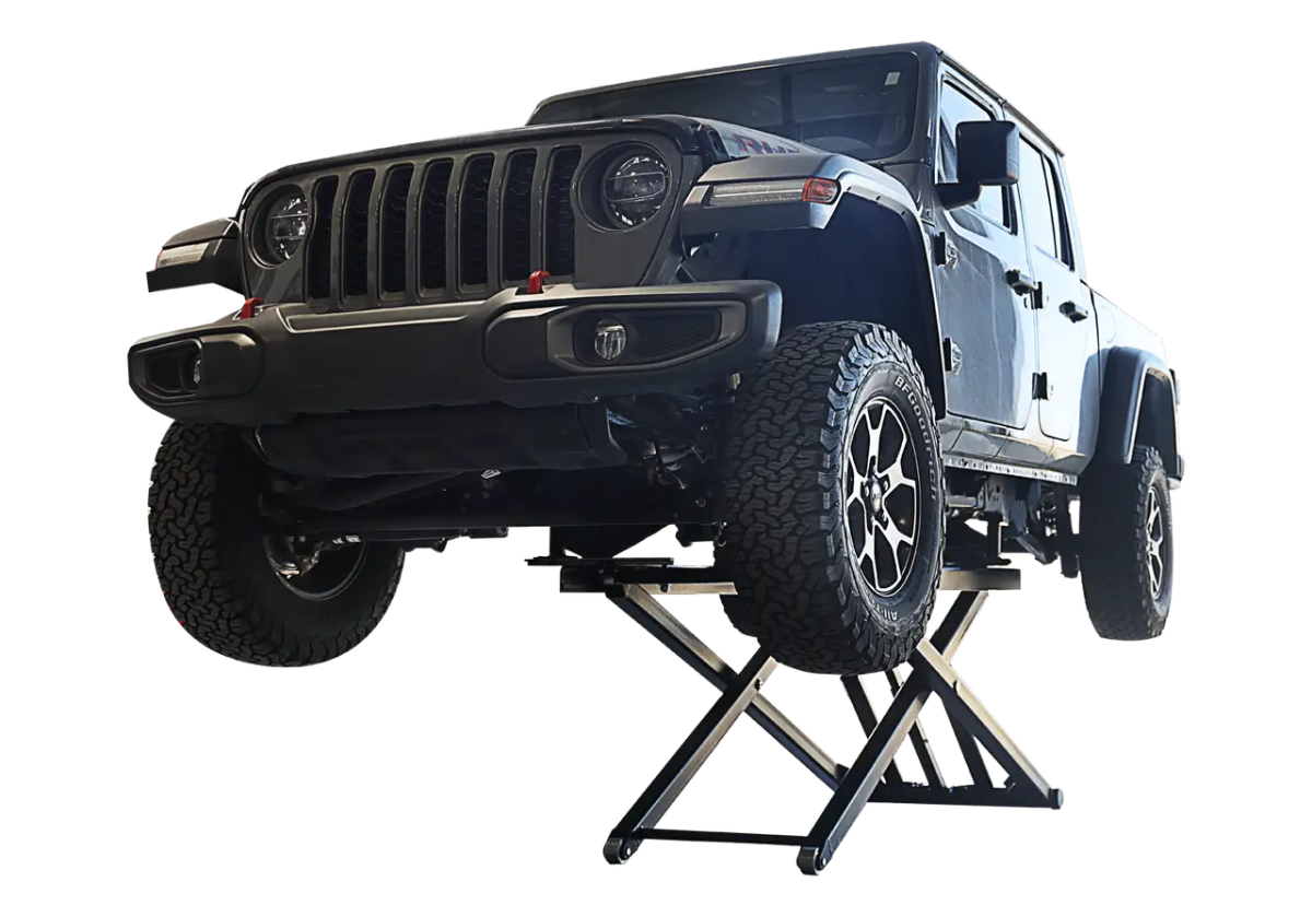 Challenger MR6 mid rise portable lift raising a Jeep Gladiator truck, demonstrating rugged lift capability and scissor mechanism for versatile vehicle service