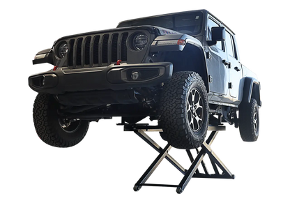 Challenger MR6 mid rise portable lift raising a Jeep Gladiator truck, demonstrating rugged lift capability and scissor mechanism for versatile vehicle service