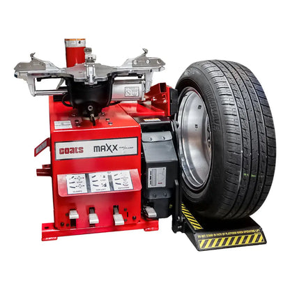 Tire changing machine with a mounted car wheel and tire.