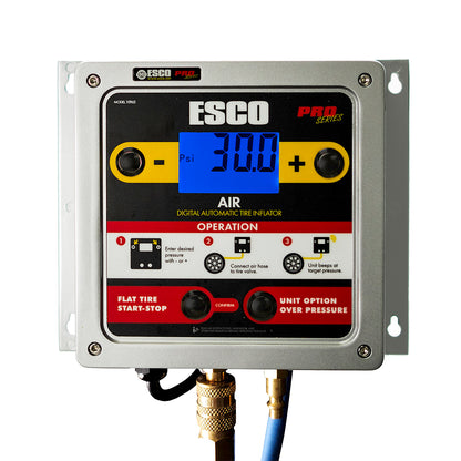 ESCO 10965 digital wall mounted tire inflator in aluminum housing, mounted on wall bracket with backlit display reading 30.0 psi and air hose connected